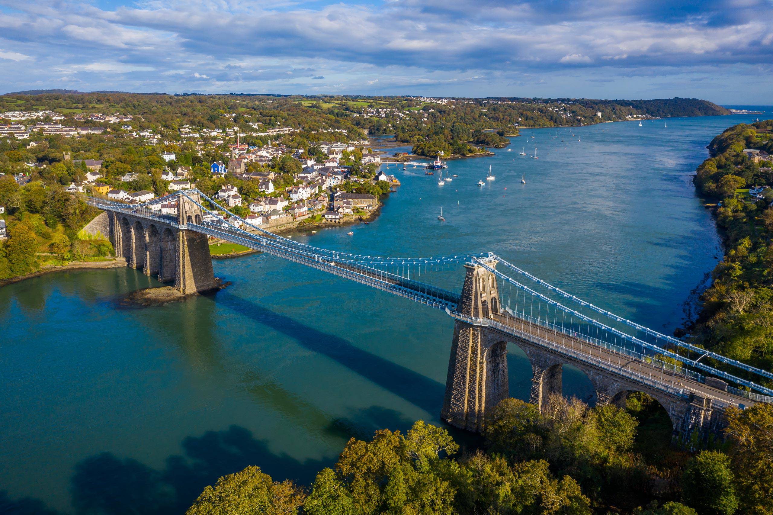 Aerial view of Menai Suspension bridge and the town in the background