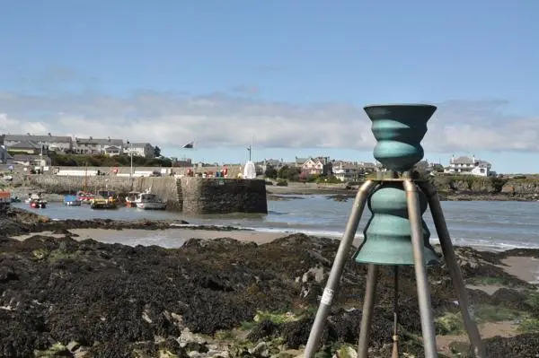 Cemaes tidal bell looking like an alien spaceship in the harbour