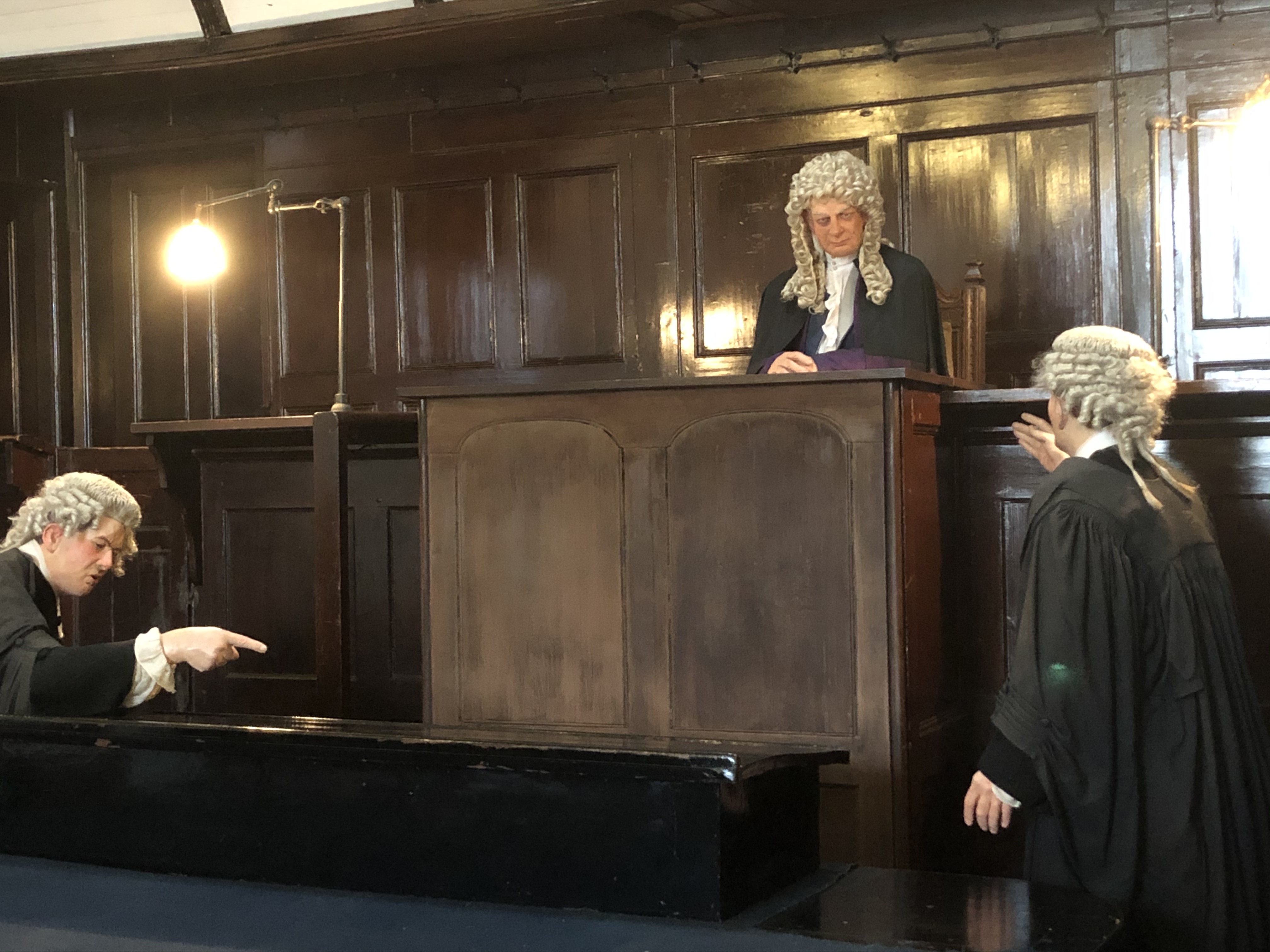 Front of courtroom looking at judge and two ushers