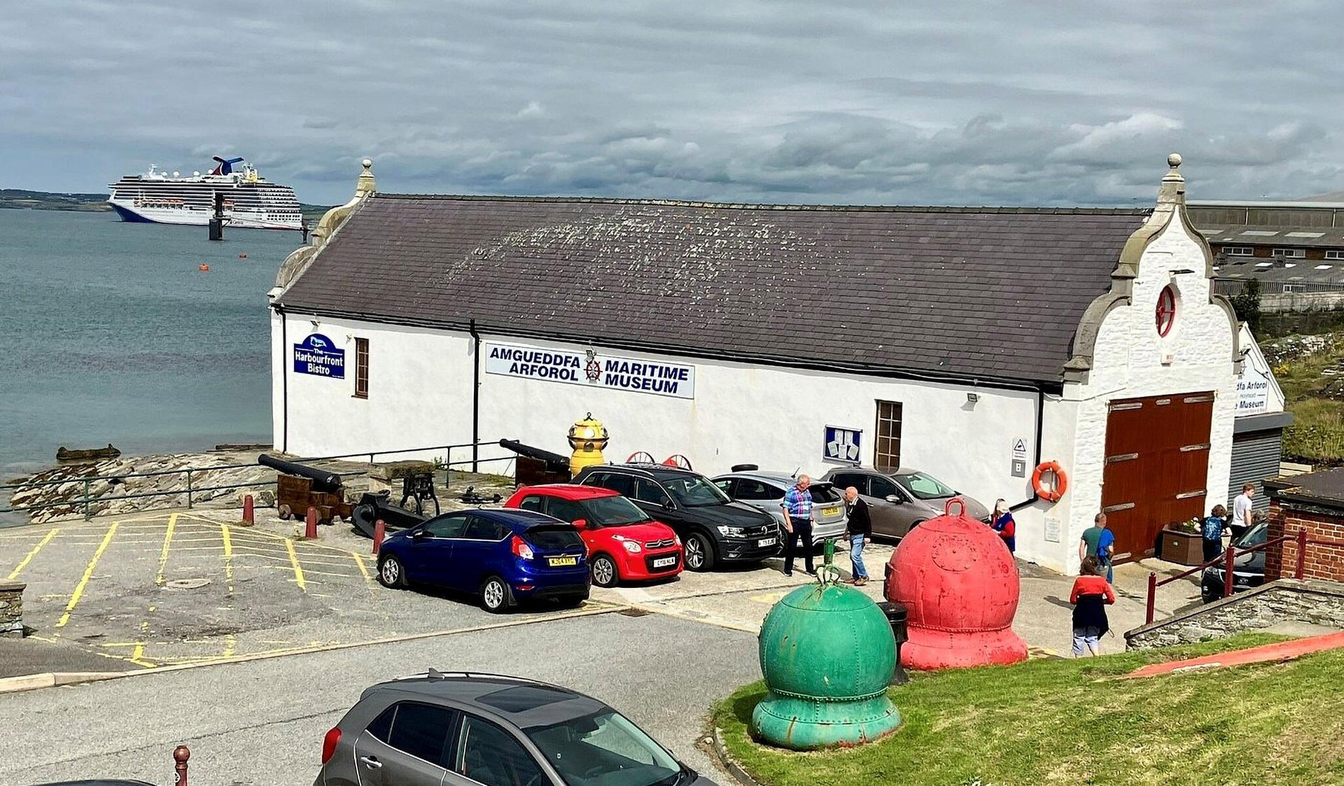 Holyhead Maritime Museum Building and old lifeboat station with Holyhead port in the background.