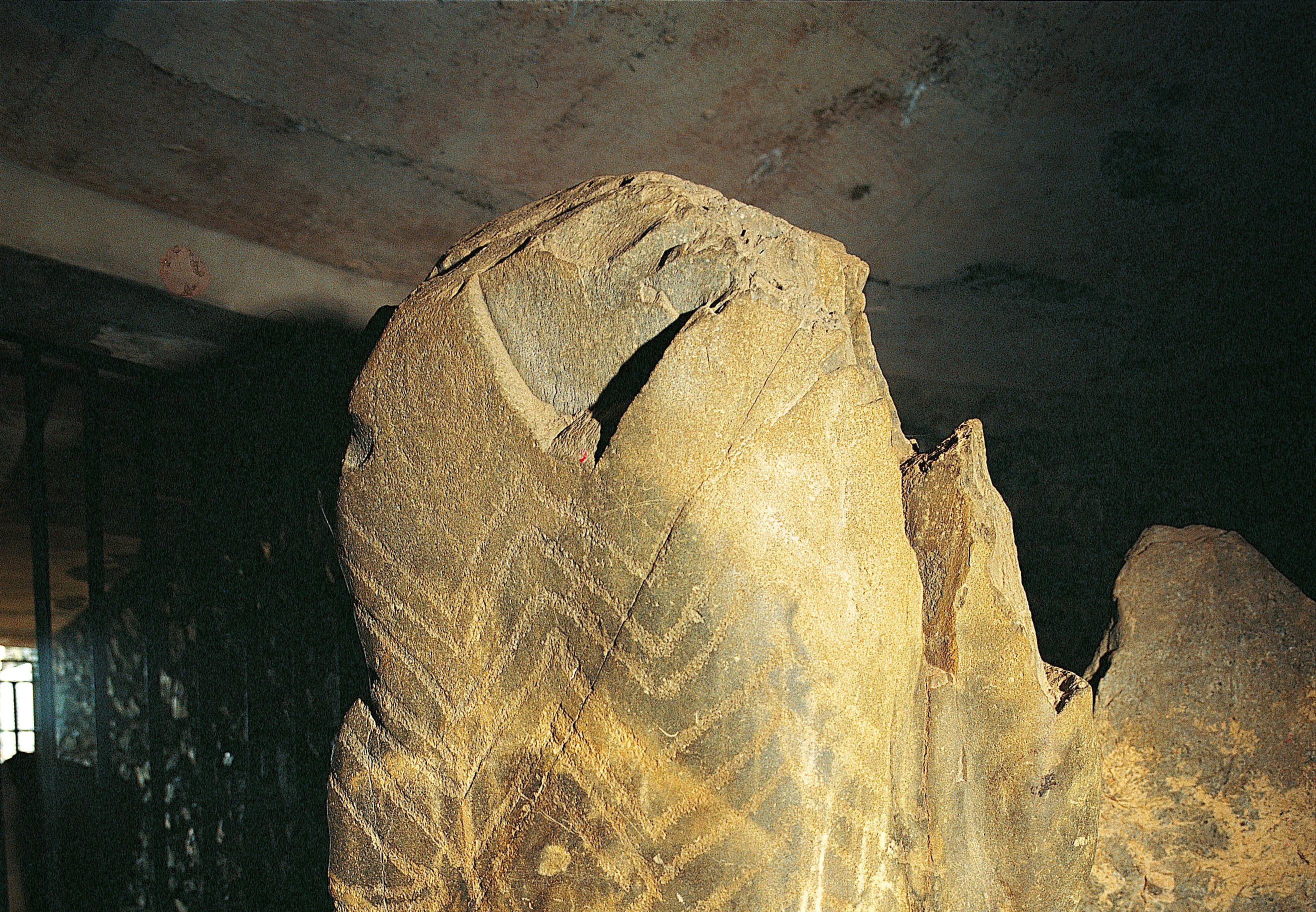 One of five ancient etched stones within Barclodiad y Gawres showing ancient zig zag patterns