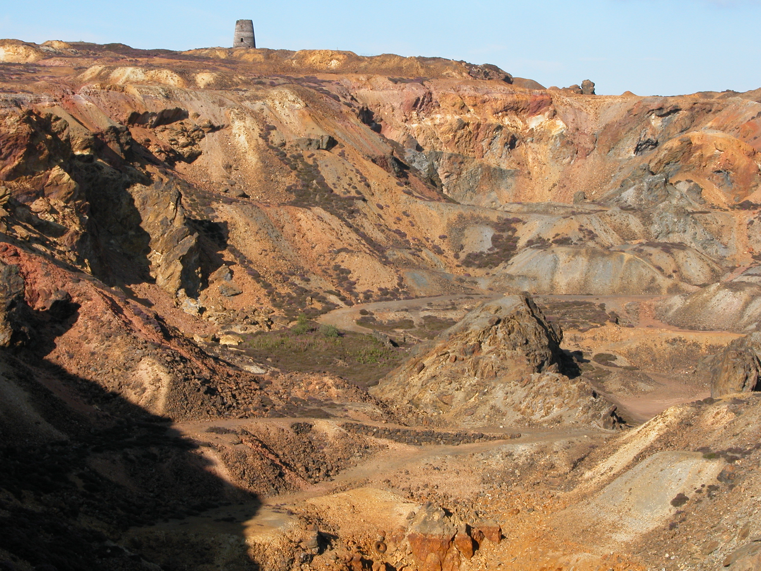 Landscape of Parys Mountain showing red rock