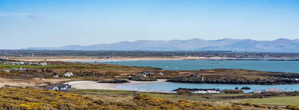 View of Rhoscolyn looking towards Snowdonia