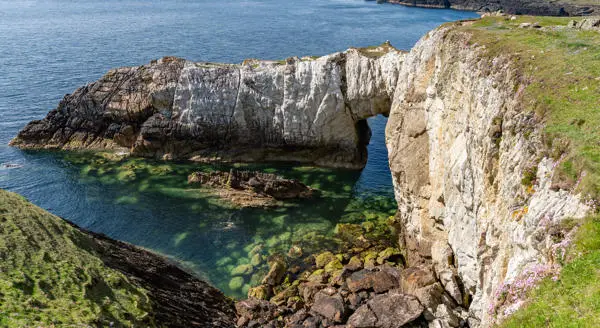 Bwa-gwyn-rhoscolyn view form the top of the cliff with blue sea